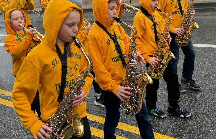 St. Sebastian Bands marches in parade